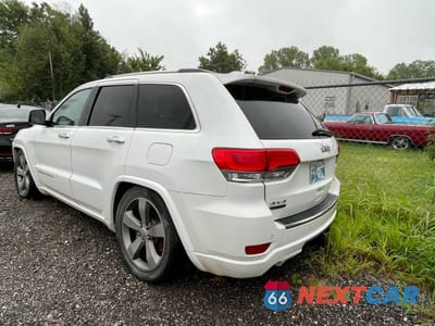 Trzecie zdjęcie samochodu z tyłu: 2014 JEEP GRAND CHEROKEE OVERLAND VIN:1C4RJFCM6EC487877 - miniatura
