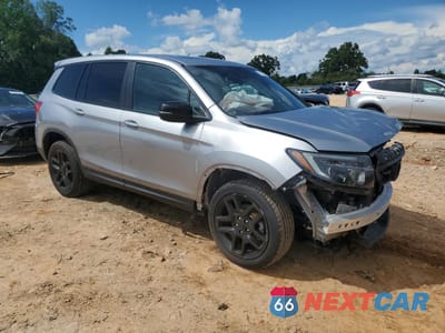 Czwarte zdjęcie samochodu z boku: 2023 HONDA PASSPORT EXL VIN:5FNYF8H59PB029556 - miniatura
