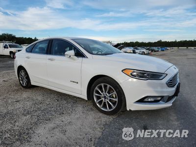 Czwarte zdjęcie samochodu z boku: 2017 FORD FUSION SE HYBRID VIN:3FA6P0LU7HR409408 - miniatura