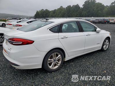 Trzecie zdjęcie samochodu z tyłu: 2018 FORD FUSION SE HYBRID VIN:3FA6P0LU0JR171794 - miniatura