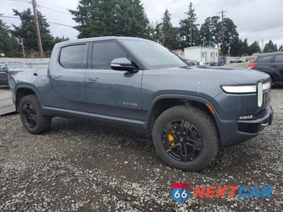 Czwarte zdjęcie samochodu z boku: 2023 RIVIAN R1T ADVENTURE VIN:7FCTGAAA7PN023885 - miniatura