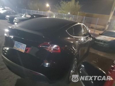Trzecie zdjęcie samochodu z tyłu: 2023 TESLA MODEL Y VIN:7SAYGDEE2PA114300 - miniatura