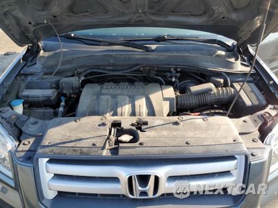 Zdjęcie 12 z 13 samochodu: 2006 HONDA PILOT EX VIN:2HKYF18696H542693 - miniatura
