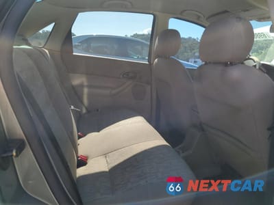Zdjęcie 10 z 14 samochodu: 2005 FORD FOCUS ZX4 VIN:1FAHP34N05W110059 - miniatura