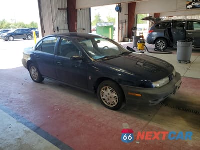 Czwarte zdjęcie samochodu z boku: 1999 SATURN SL1 VIN:1G8ZH5288XZ178819 - miniatura