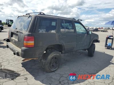 Trzecie zdjęcie samochodu z tyłu: 1997 JEEP GRAND CHEROKEE LAREDO VIN:1J4GZ58S9VC541295 - miniatura