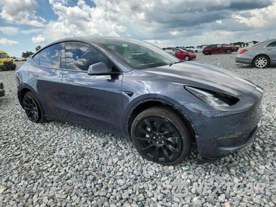 Czwarte zdjęcie samochodu z boku: 2023 TESLA MODEL Y VIN:7SAYGDEE2PA058214 - miniatura