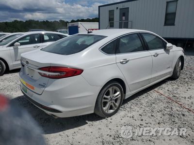 Trzecie zdjęcie samochodu z tyłu: 2018 FORD FUSION SE HYBRID VIN:3FA6P0LU2JR172025 - miniatura