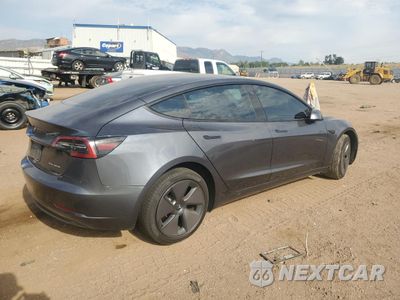 Trzecie zdjęcie samochodu z tyłu: 2023 TESLA MODEL 3 VIN:5YJ3E1EB8PF634733 - miniatura