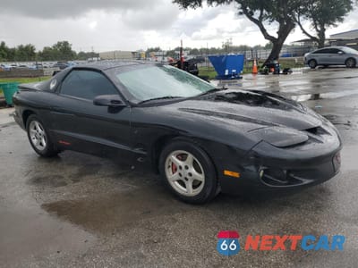 Czwarte zdjęcie samochodu z boku: 1999 PONTIAC FIREBIRD VIN:2G2FS22K7X2232302 - miniatura