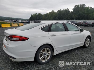Trzecie zdjęcie samochodu z tyłu: 2018 FORD FUSION SE HYBRID VIN:3FA6P0LU3JR129944 - miniatura