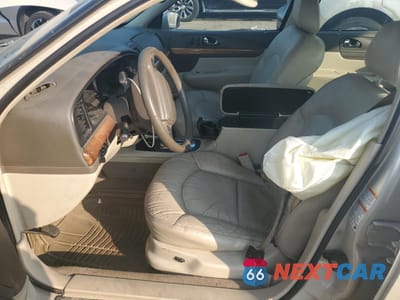 Zdjęcie 7 z 14 samochodu: 2002 LINCOLN CONTINENTAL VIN:1LNHM97V42Y619021 - miniatura