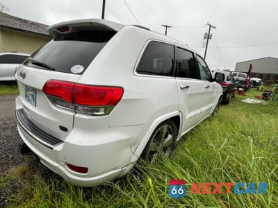 Czwarte zdjęcie samochodu z boku: 2014 JEEP GRAND CHEROKEE OVERLAND VIN:1C4RJFCM6EC487877 - miniatura