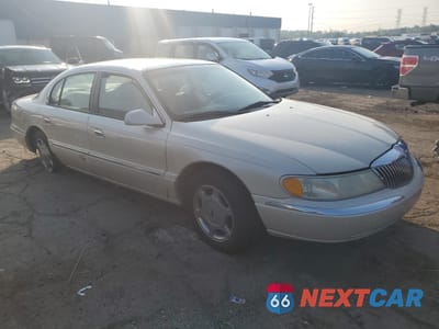 Czwarte zdjęcie samochodu z boku: 2002 LINCOLN CONTINENTAL VIN:1LNHM97V42Y619021 - miniatura