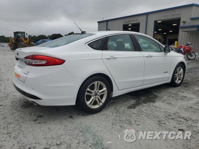 Trzecie zdjęcie samochodu z tyłu: 2018 FORD FUSION SE HYBRID VIN:3FA6P0LU3JR278743 - miniatura