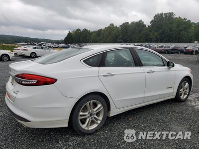 Trzecie zdjęcie samochodu z tyłu: 2018 FORD FUSION SE HYBRID VIN:3FA6P0LU1JR162599 - miniatura