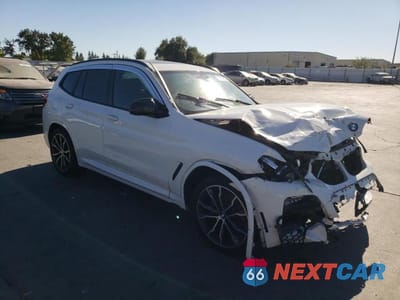 Czwarte zdjęcie samochodu z boku: 2021 BMW X3 XDRIVE30E VIN:5UXTS1C02M9D96766 - miniatura