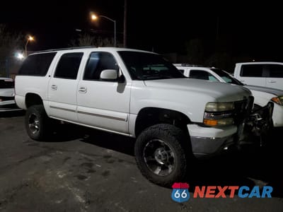 Czwarte zdjęcie samochodu z boku: 2002 CHEVROLET SUBURBAN K1500 VIN:1GNFK16T42J113868 - miniatura