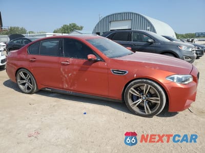 Czwarte zdjęcie samochodu z boku: 2014 BMW M5 VIN:WBSFV9C52ED593702 - miniatura