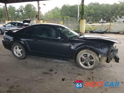 Czwarte zdjęcie samochodu z boku: 2004 FORD MUSTANG VIN:1FAFP40694F139330 - miniatura