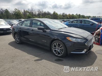 Czwarte zdjęcie samochodu z boku: 2017 FORD FUSION SE HYBRID VIN:3FA6P0LU0HR374596 - miniatura