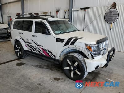 Czwarte zdjęcie samochodu z boku: 2010 DODGE NITRO SE VIN:1D4PU2GK5AW143176 - miniatura