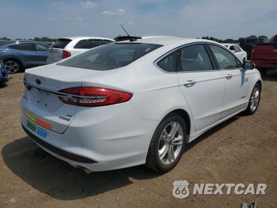 Trzecie zdjęcie samochodu z tyłu: 2018 FORD FUSION SE HYBRID VIN:3FA6P0LU0JR129870 - miniatura