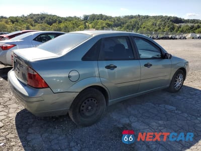 Trzecie zdjęcie samochodu z tyłu: 2005 FORD FOCUS ZX4 VIN:1FAHP34N05W110059 - miniatura