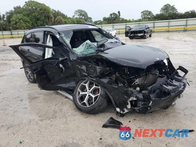 Czwarte zdjęcie samochodu z boku: 2017 BMW X1 SDRIVE28I VIN:WBXHU7C35H5H38032 - miniatura