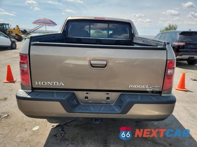 Zdjęcie 6 z 13 samochodu: 2010 HONDA RIDGELINE RTS VIN:5FPYK1F4XAB009800 - miniatura