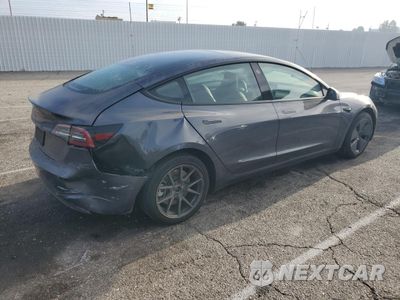 Trzecie zdjęcie samochodu z tyłu: 2023 TESLA MODEL 3 VIN:5YJ3E1EA3PF649888 - miniatura