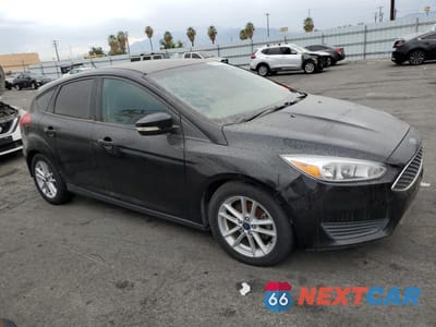 Czwarte zdjęcie samochodu z boku: 2017 FORD FOCUS SE VIN:1FADP3K21HL278287 - miniatura