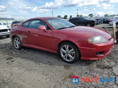 Czwarte zdjęcie samochodu z boku: 2005 HYUNDAI TIBURON GT VIN:KMHHN65F25U160235 - miniatura