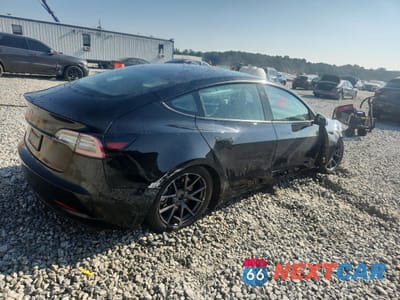 Trzecie zdjęcie samochodu z tyłu: 2023 TESLA MODEL 3 VIN:5YJ3E1EA2PF422787 - miniatura