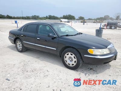 Czwarte zdjęcie samochodu z boku: 1999 LINCOLN CONTINENTAL VIN:1LNHM97V9XY634170 - miniatura