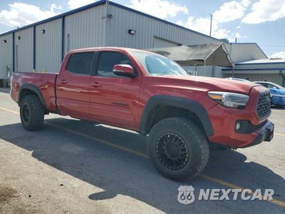 Czwarte zdjęcie samochodu z boku: 2023 TOYOTA TACOMA DOUBLE CAB VIN:3TMDZ5BN7PM143354 - miniatura