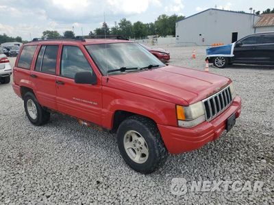 Czwarte zdjęcie samochodu z boku: 1998 JEEP GRAND CHEROKEE LAREDO VIN:1J4GZ48S6WC282812 - miniatura