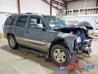 Czwarte zdjęcie samochodu z boku: 2000 GMC YUKON VIN:1GKEC13V7YJ175866 - miniatura