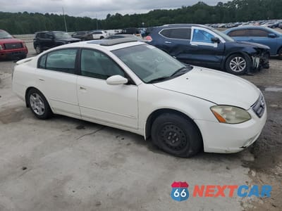 Czwarte zdjęcie samochodu z boku: 2003 NISSAN ALTIMA BASE VIN:1N4AL11D63C242836 - miniatura