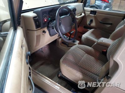 Zdjęcie 8 z 14 samochodu: 1999 JEEP WRANGLER / TJ SPORT VIN:1J4FY19S1XP492501 - miniatura