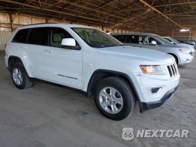 Czwarte zdjęcie samochodu z boku: 2014 JEEP GRAND CHEROKEE LAREDO VIN:1C4RJFAGXEC186476 - miniatura