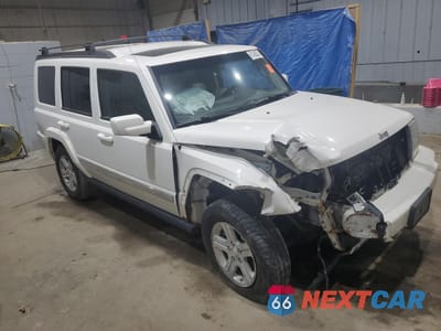 Czwarte zdjęcie samochodu z boku: 2009 JEEP COMMANDER LIMITED VIN:1J8HG58P79C521606 - miniatura