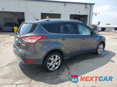 Trzecie zdjęcie samochodu z tyłu: 2016 FORD ESCAPE TITANIUM VIN:1FMCU0JX9GUC09216 - miniatura