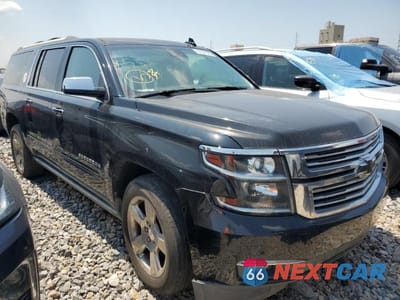 Czwarte zdjęcie samochodu z boku: 2018 CHEVROLET SUBURBAN K1500 PREMIER 4WD VIN:1GNSKJKC8JR189906 - miniatura