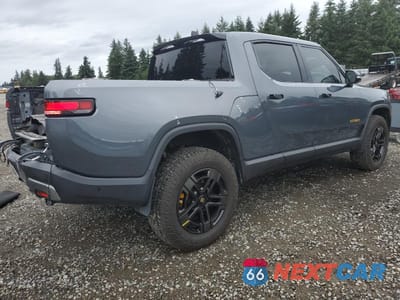 Trzecie zdjęcie samochodu z tyłu: 2023 RIVIAN R1T ADVENTURE VIN:7FCTGAAA7PN023885 - miniatura