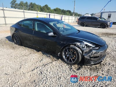 Czwarte zdjęcie samochodu z boku: 2023 TESLA MODEL 3 VIN:5YJ3E1EA2PF422787 - miniatura