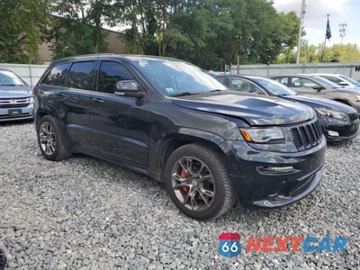 Czwarte zdjęcie samochodu z boku: 2015 JEEP GRAND CHEROKEE SRT-8 VIN:1C4RJFDJ0FC894583 - miniatura