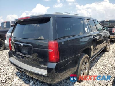 Trzecie zdjęcie samochodu z tyłu: 2018 CHEVROLET SUBURBAN K1500 PREMIER 4WD VIN:1GNSKJKC8JR189906 - miniatura