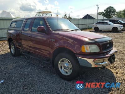 Czwarte zdjęcie samochodu z boku: 1997 FORD F150 VIN:1FTDX0868VKA66216 - miniatura