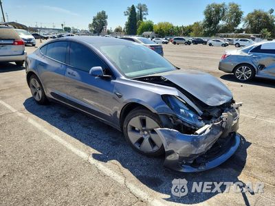 Czwarte zdjęcie samochodu z boku: 2022 TESLA MODEL 3 VIN:5YJ3E1EBXNF171572 - miniatura